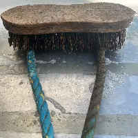 Reclaimed fishing rope being cleaned, showing the colour contrast between weathered rope and freshly scrubbed rope.