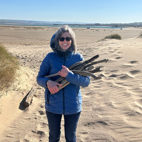 This is a photograph of me on the beach collecting driftwood at Crow Point, Braunton.